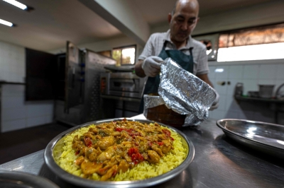 Egypt’s Sudanese refugees using rich cuisine to build new lives A Sudanese chef traditional food at a restaurant run by a businesswoman who relocated to the Egyptian capital Cairo after fleeing the ongoing war in Sudan, on May 21, 2024. — AFP pic