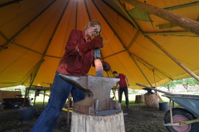 In Denmark, blacksmiths steer journey into Viking ship’s past Mischa Kunckel from Britain’s National School of Blacksmithing hammers iron against an anvil near the Viking Ship Museum in Roskilde, Denmark. — AFP pic