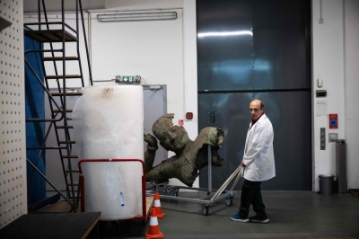 The high-tech art lab hidden underneath Paris Archaeo-metallurgist of the Centre for Research and Restoration of Museums of France (C2RMF) David Bourgarit moves a 11th-century bronze statue of the famous reclining Vishnu, recently arrived from Cambodia, to be restored at the C2RMF at the Louvre museum, in Paris on June 6, 2024. — AFP pic