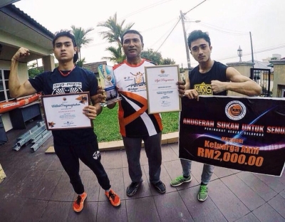 ‘He would go the extra mile’: Former taekwondo athlete Zulhilmi Nadzeri on dad’s role in his success Zulhimi (left) and his brother Zulfadli (right) welcomed by their father Nadzeri Mustaffa at KLIA after winning the 2016 World Calisthenic Championship with the national team. —  Picture by Arif Zikri