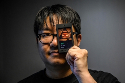 Meteoric rise of S. Korea’s webtoons powers Nasdaq IPO In this picture taken on May 24, 2024 digital comic artist Bae Jin-soo, who created the Naver webtoons ‘Money Game’ and ‘Pie Game’ which inspired Netflix’s ‘The 8 Show’, poses with a Webtoons card for ‘Money Game’, during an interview with AFP in Seoul. — AFP pic