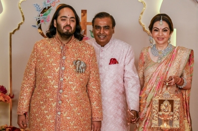 Wedding party resumes for youngest son of Mukesh Ambani, Asia’s richest man Billionaire tycoon and chairman of Reliance Industries Mukesh Ambani (centre), wife Nita Ambani (right) and son Anant Ambani at the wedding ceremony in Mumbai. — AFP pic