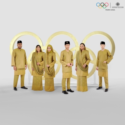 Six Malaysian athletes led by national contingent flag bearers model 2024 Paris Olympics opening ceremony attire A golden vision. — Image courtesy of Rizman Ruzaini