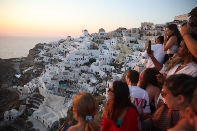 Greece’s ‘Instagram island’ Santorini mulls visitor cap amid overtourism woes Tourists wait for the sunset in the village of Oia on the Greek island of Santorini on July 20, 2024. — AFP pic