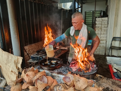 How a little durian made a big difference to a humble akok in Kampung Baru The arrival of the durian season provides additional income for akok seller Abd Malik Abd Hamid, as his durian akok sells out every day. — Bernama pic