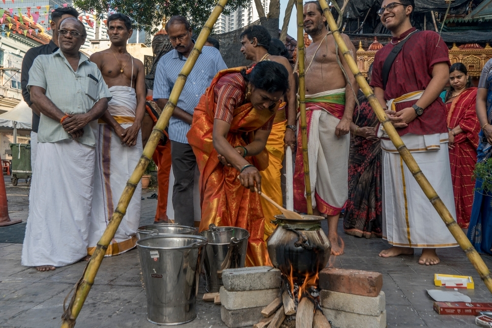 What is Pongal and how is it celebrated in Malaysia? File photo of a woman preparing sarkarai pongal — rice boiled in milk with jaggery — during the Pongal celebrations in Kuala Lumpur on January 15, 2023. — Picture by Shafwan Zaidon