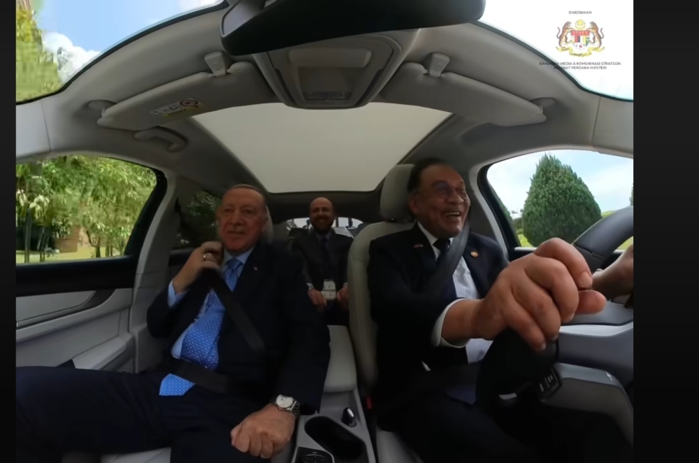 PM Anwar test drives Turkish EV with Erdogan, jokes about trust behind the wheel (VIDEO) The white Togg T10X was presented to Anwar as a gift from Erdogan, symbolising their close friendship following the Turkish leader’s two-day visit to Malaysia.— Picture via Facebook