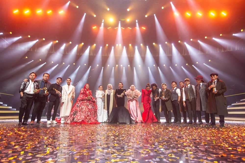 Twenty-year wait finally over: Sabahan singer Marsha Milan crowned winner of AJL39 Marsha Milan (centre) celebrates with fellow winners and finalists of Anugerah Juara Lagu 2025 on stage after the awards ceremony onFebruary 16, 2025. — Picture by Raymond Manuel