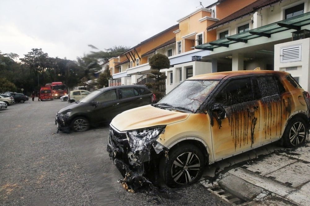 Glass shattered, leaves scorched: Residents still traumatised hours after Putra Heights fire Burnt cars and houses are seen at Taman Harmoni in Putra Heights after the gas pipeline fire April 1, 2025. — Picture by Choo Choy May
