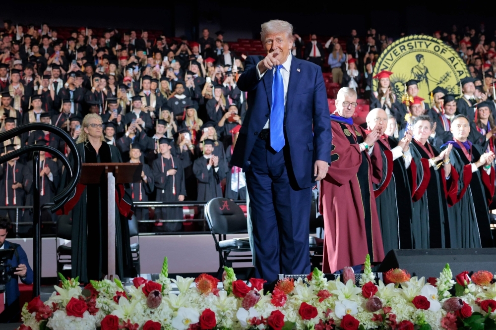 ‘Trump’s 100 years behind the times’: Dr Mahathir accuses US of fuelling Gaza genocide, destabilising region by confronting Beijing US President Donald Trump walks offstage after delivering remarks to graduating students at the Coleman Coliseum at the University of Alabama on May 1, 2025 in Tuscaloosa, Alabama. — AFP pic
