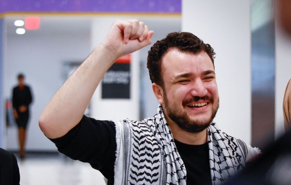‘Even if they kill me’: Freed protest leader Mahmoud Khalil vows to keep speaking out for Palestine Former Columbia University student Mahmoud Khalil reacts as he arrives to Newark airport in Newark, New Jersey, June 21, 2025. — AFP pic