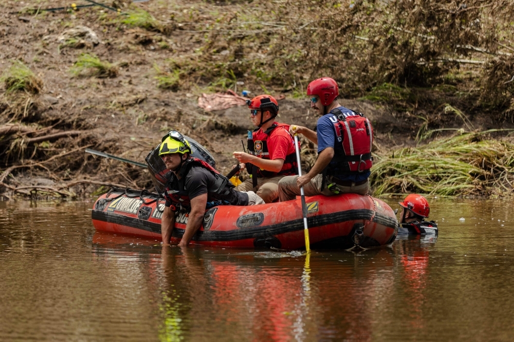Texas flood death toll tops 100, including 27 girls and summer camp staff Search and rescue workers use a sonar device while paddling down the Guadalupe River looking for survivors or the remains of victims swept up in the flash flood on July 7. — AFP pic