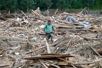 AI-powered warning system brings hope to Nepal’s landslide-hit villages A man walks through a landslide-hit area after heavy rain in Lalitpur district, on the outskirts of Kathmandu October 1, 2024. Each year during the monsoon, floods and landslides wreak havoc across South Asia, with Nepal especially vulnerable due to unstable terrain, erratic rainfall and poor planning. — AFP pic