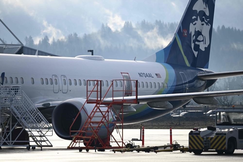 Boeing faces lawsuit from Alaska Airlines crew over MAX 9 mid-air blowout Alaska Airlines N704AL, a 737 Max 9, which made an emergency landing at Portland International Airport on January 5 is parked at a maintenance hangar in Portland, Oregon on January 23, 2024. Four Alaska Airlines flight attendants who were on board the 737 MAX 9 that suffered a mid-air cabin panel blowout are suing Boeing, alleging both physical and emotional harm. — AFP pic