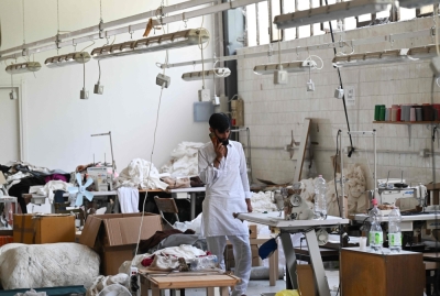 With ‘Hanger War’, Chinese mafia factions are turning Italy’s fast fashion capital into a battleground A Pakistani worker gives a phone call during a permanent strike in a fast-fashion outlet factory owned by a Chinese company in Prato, central Italy, on August 1, 2025. — AFP pic