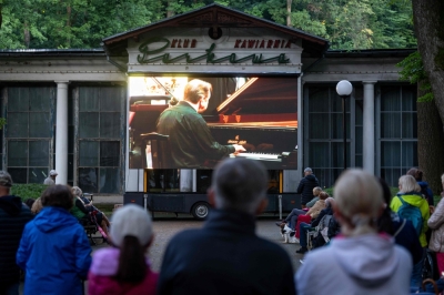 ‘Musical cocoon’: In Polish mountain town where Chopin first played abroad, music lovers return for 80th festival People in the park outside the concert tent listen to the music and watch the live broadcast on a giant screen during the opening concert of the 80th Duszniki International Chopin Piano Festival in Duszniki Zdroj, southwestern Poland, August 2, 2025. — AFP pic