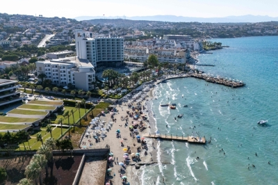 In Turkiye’s tourist coast Izmir, village forced to dig 170m for water as hotels keep pools full amid drought This aerial photograph shows bathers enjoying in the sea in front of a hotel in Cesme, in the Turkey west province of Izmir, on July 30, 2025. — AFP pic