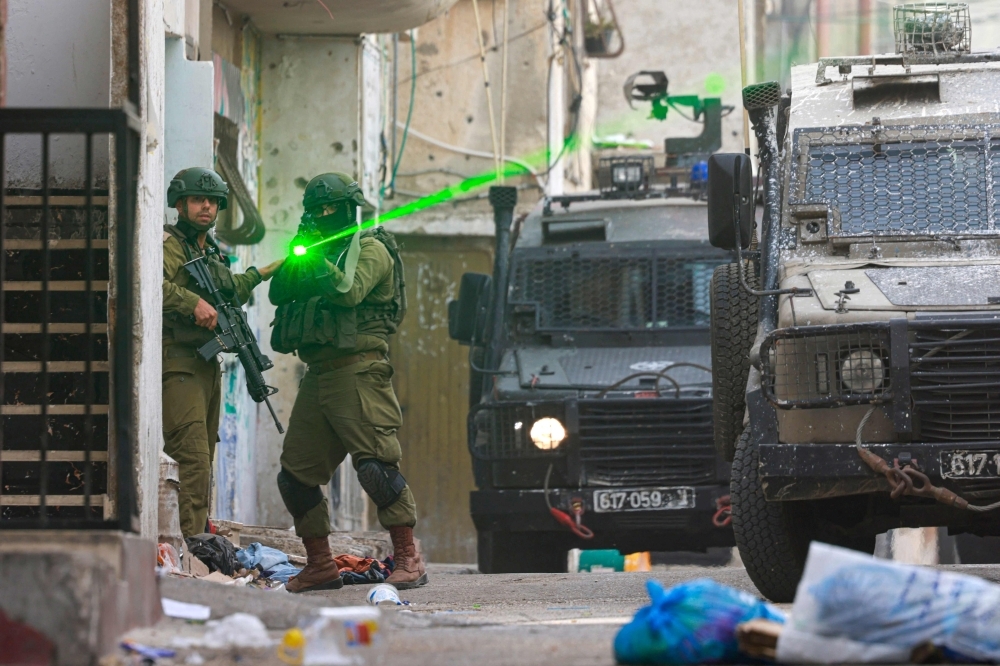 Egypt says working with Qatar, US on 60-day Gaza ceasefire plan An Israeli soldier aims his weapon during a raid at the Balata refugee camp east of Nablus city in the occupied West Bank on August 11, 2025. Violence in the West Bank, which Israel has occupied since 1967, has surged throughout the Gaza war that began in October 2023. — AFP pic