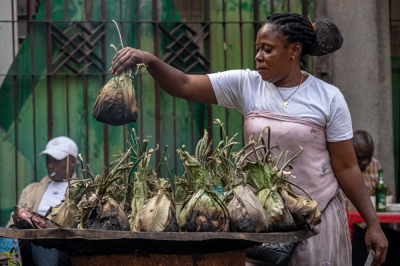 French dictionary sparks controversy over the true meaning of Congo’s iconic banana leaf dish, ‘liboke’ A vendor grills liboke in Kinshasa. — AFP pic