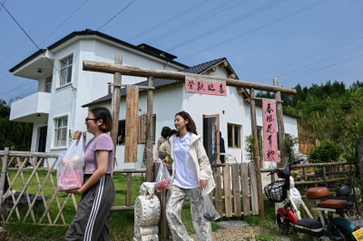 Rooms of their own: Women-only communities thrive in China The photo taken on July 15, 2025 shows Chen Yani (centre), also known as ‘Keke’ heading out with guests in Hangzhou, in eastern China's Zhejiang province. — AFP pic