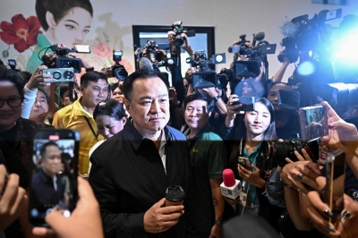 Thai opposition’s kingmaking summit fails to back new PM Bhumjaithai Party leader Anutin Charnvirakul is surrounded by media representatives at the party's headquarters in Bangkok on September 1, 2025. — AFP pic