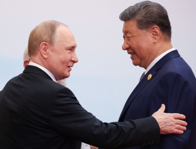 China’s Xi, Russia’s Putin put on united front against West at regional bloc gathering In this pool photograph distributed by the Russian state agency Sputnik, Russia’s President Vladimir Putin speaks with India's Prime Minister Narendra Modi (centre) and China’s President Xi Jinping during the Shanghai Cooperation Organisation (SCO) Summit in Tianjin on September 1, 2025. — AFP pic