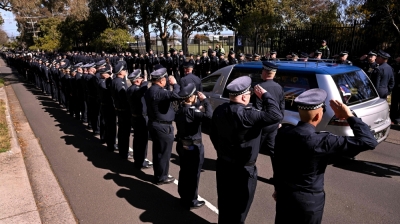 Manhunt intensifies as Australia offers record RM2.7m reward for gunman in police officer killings A police guard of honour salutes as the coffin of police officer Senior Constable Vadim de Waart-Hottart leaves the Victoria Police Academy chapel following a funeral service, in Melbourne on September 5, 2025. Around a thousand people have gathered for a funeral of de Waart-Hottart, one of two Victoria Police officers killed in a shooting at Porepunkah in Victoria's north-east last week. Suspected gunman Dezi Freeman fled into dense bushland on foot, sparking an enormous manhunt involving hundreds of police officers that is now in its 12th day. — AFP pic
