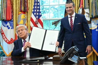 Trump rebrands Pentagon as ‘Department of War’, calls it a ‘message of victory’ US President Donald Trump shows a signed executive order as the Secretary of Defense Pete Hegseth looks on in the Oval Office of the White House in Washington, DC on September 5, 2025. — AFP pic