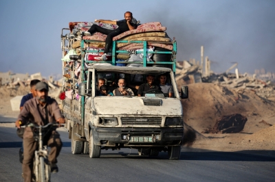 Israel flattens Gaza City high-rise as it tells residents to flee Palestinians fleeing south, ride a truck with their belongings, on the coastal road near the Nuseirat refugee camp in the central Gaza Strip, on August 5, 2025. Despite mounting pressure at home and abroad to halt its nearly two-year offensive in Gaza, Israel has been calling up reservists, intensifying its bombardments and closing in on Gaza City ever since announcing its intention to capture the Palestinian territory's largest city. — AFP pic