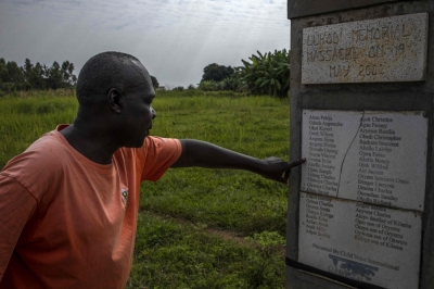 ‘We were forced to eat our teachers’: Survivors recall horrors as Ugandan warlord Joseph Kony faces international trial Wilfred Lalobo, 60, a survivor of the Lukodi massacre on May 19, 2004, in which his daughter and several other relatives were killed, points to familiar names on the commemorative plaque of the Lukodi Memorial Massacre Monument in Lukodi village, Gulu district, on September 4, 2025. — AFP pic