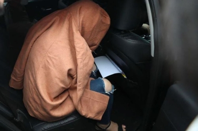 ‘Suitcase Murders’: Trial for South Korean mother accused of killing own children begins in New Zealand Hakyung Lee was extradited from Seoul in 2022 after the remains of her children, both aged under 10, were discovered in suitcases that had been left at a storage unit in south Auckland. — AFP pic