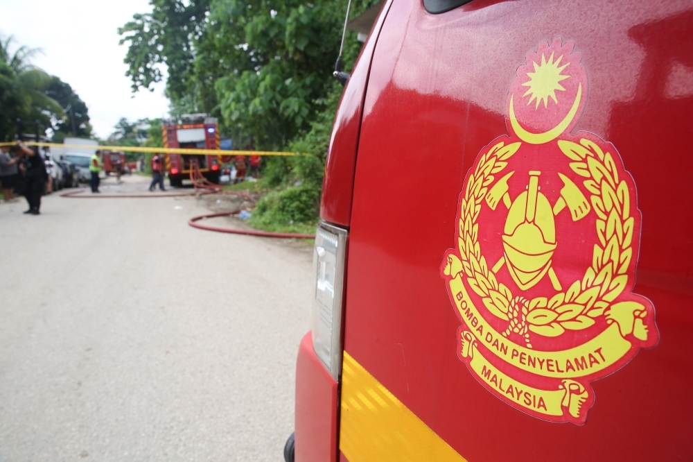 One-acre forest fire erupts near FRIM in Kepong Bomba firefighters work to extinguish a fire at a factory area on June 21, 2025. — Picture by Choo Choy May