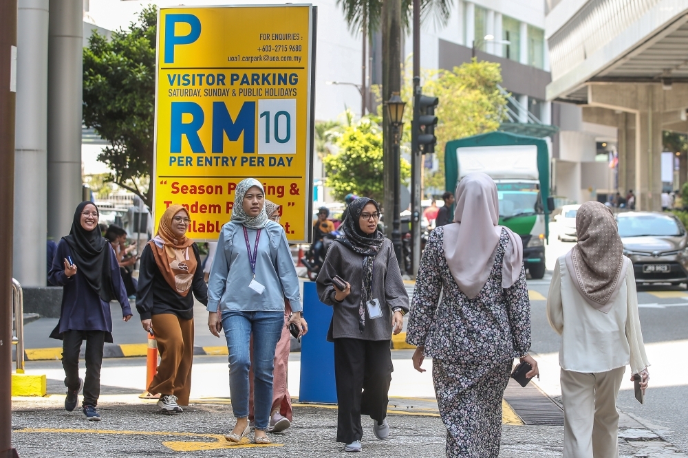 Malaysia jumps eight spots in global talent ranking while Singapore shows surprising decline Office workers are seen during lunch hour in Kuala Lumpur on July 30, 2024. — Picture by Yusof Mat