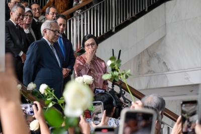 Call from palace, gone in an hour: Indonesian finance czar Sri Mulyani’s abrupt exit from Prabowo’s Cabinet Sri Mulyani Indrawati (centre) sends a goodbye kiss to Finance Ministry staff after the handover ceremony to her successor Purbaya Yudhi Sadewa in Jakarta, Indonesia on September 9, 2025. — AFP pic