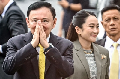 Thailand’s ex-PM Thaksin begins first full day behind bars after Supreme Court ruling Thailand’s former prime minister Thaksin Shinawatra arrives with his daughter Thailand’s sacked prime minister Paetongtarn Shinawatra (right) at the Supreme Court in Bangkok September 9, 2025. — AFP pic