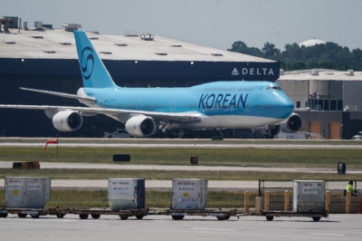 Plane waits on tarmac as South Korea begs US to free workers caught in immigration sweep The Yonhap news agency reported that the Korean Air Boeing 747-8I due to take the workers back home will leave the United States early Thursday. — AFP pic