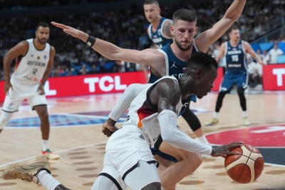 Hong Kong says yes to slam dunk bets — basketball gambling now legal Players from Germany and Slovenia battle for the ball during their EuroBasket 2025 quarter-final in Riga, Latvia, September 10. — AFP pic