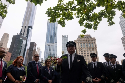 New York marks 24 years since 9/11 amid divisive political backdrop Pilots and airline workers from both United and American Airlines participate in a wreath laying ceremony for their colleagues who were killed on September 11 at the National September 11 Memorial & Museum on September 10, 2025 in New York City. — AFP pic