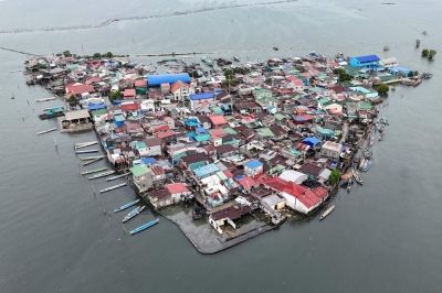 Sinking ground, rising sea: Filipinos on Pugad Island fight to stay afloat This aerial view taken on July 7, 2025, shows cramped houses on Isla Pugad in Hagonoy town, Bulacan province, north of Manila. Sea levels across the Philippines as a whole are rising three times faster than the global average of 3.6 millimeters per year, and the Department of Environment and Natural Resources (DENR) has said this could accelerate to 13 millimeters annually. — AFP pic