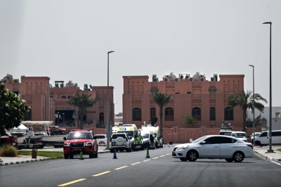Funeral tomorrow in Doha for Hamas officials, Qatari officer killed in Israeli strike A picture taken from a distance shows the damaged building (L) in the compound housing members of Palestinian militant group Hamas's political bureau which was targeted the previous day by an Israeli strike in Qatar's capital Doha, on September 10, 2025. — AFP pic