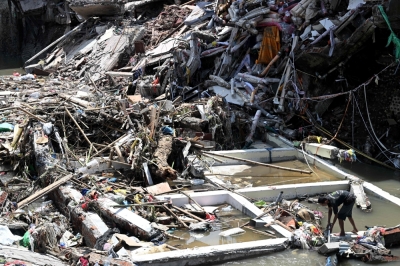 Indonesia floods and landslides kill 23 in Bali and Flores, five missing A man walks on the rubble of a collapsed building following flooding in Denpasar on the Indonesian resort island of Bali on September 12, 2025. — AFP pic