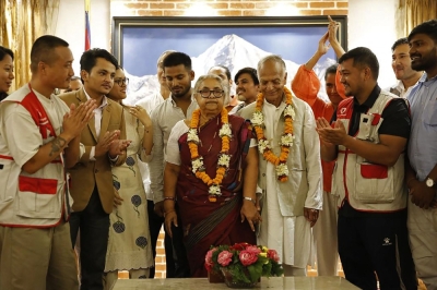 Former chief justice Sushila Karki sworn in as Nepal’s first female PM after violent anti-corruption unrest Nepal’s newly appointed Prime Minister Sushila Karki (centre) is congratulated by her supporters after the swearing-in-ceremony at the President House in Kathmandu September 12, 2025. — AFP pic