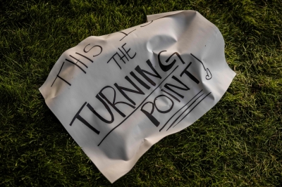 Charlie Kirk assassination deepens America’s political divide as online witch-hunts spread A sign that reads “This Is The Turning Point” lies next to a memorial for political activist Charlie Kirk at Utah Valley University on September 13, 2025. — AFP pic