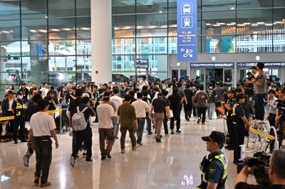 Seoul to review rights violations during US raid South Korean workers arrive at Incheon International Airport in Incheon on September 12, 2025, after the touch down of a specially chartered Korean Air Boeing 747-81 (KE9036) bringing hundreds of South Korean workers back from Atlanta after their detention in a US immigration raid at a Hyundai-LG plant in Ellabell, Georgia. — AFP pic