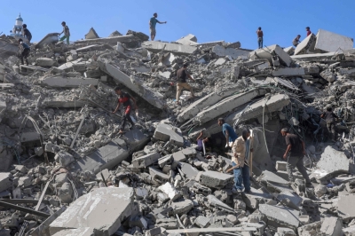 Israel launches heavy Gaza bombardment after Rubio pledges US support TOPSHOT - Palestinians search the rubble of al-Ghafari tower after its destruction by Israeli airstrikes in Gaza City on September 15, 2025. — AFP pic