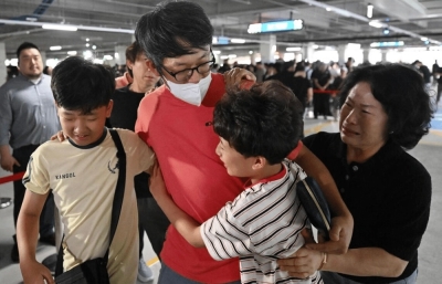 US ‘regrets’ mass Georgia raid on Korean workers, says Seoul envoy A South Korean worker detained during a US immigration raid at a US Hyundai plant returns to his family in Incheon. — AFP pic
