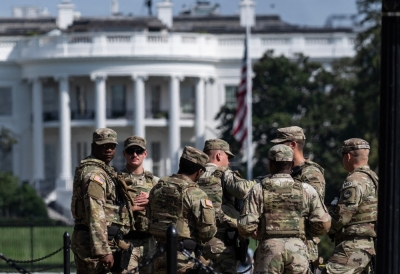 Mulch, trash and patrols: US National Guard takes on unexpected duties in Washington amid controversy Members of the National Guard stand near the National Mall as a flag flies at half staff on the South Lawn of the White House in Washington, DC on September 11, 2025. — Reuters pic