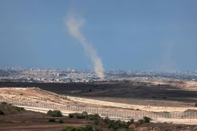 ‘On fire’: Israeli defence chief vows no let-up as Gaza City pounded This picture taken from a position at Israel's border with the Gaza Strip shows smoke billowing amid Israeli bombardment of the besieged Palestinian territory today. — AFP pic
