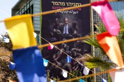 Iran executes man accused of feeding secrets to Israel’s Mossad This picture shows an anti-Israeli billboard displaying a picture of Israeli Prime Minister Benjamin Netanyahu with the words in Hebrew, ‘Netanyahu is gambling on the lives of your children,’ and in Persian, ‘Mad Criminal,’ at Palestine Square in Tehran on September 15, 2025. — AFP pic