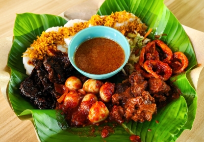 ‘Lontong darat’ — why foodies are flocking to Mersing for this rare Johor delicacy Unlike regular ‘lontong’, ‘lontong darat’ is served without coconut gravy, featuring compressed rice with various sides such as ‘sambal’, ‘rendang’, peanut sauce and grated coconut floss. — Bernama pic